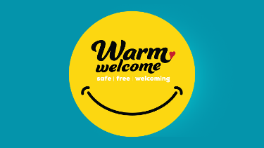 warm welcome logo: safe, free welcoming