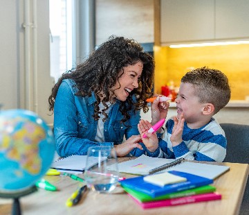 Adult and child working together at a table