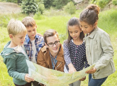 Group of children looking at a map