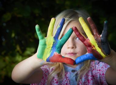 Child with paint on her hands